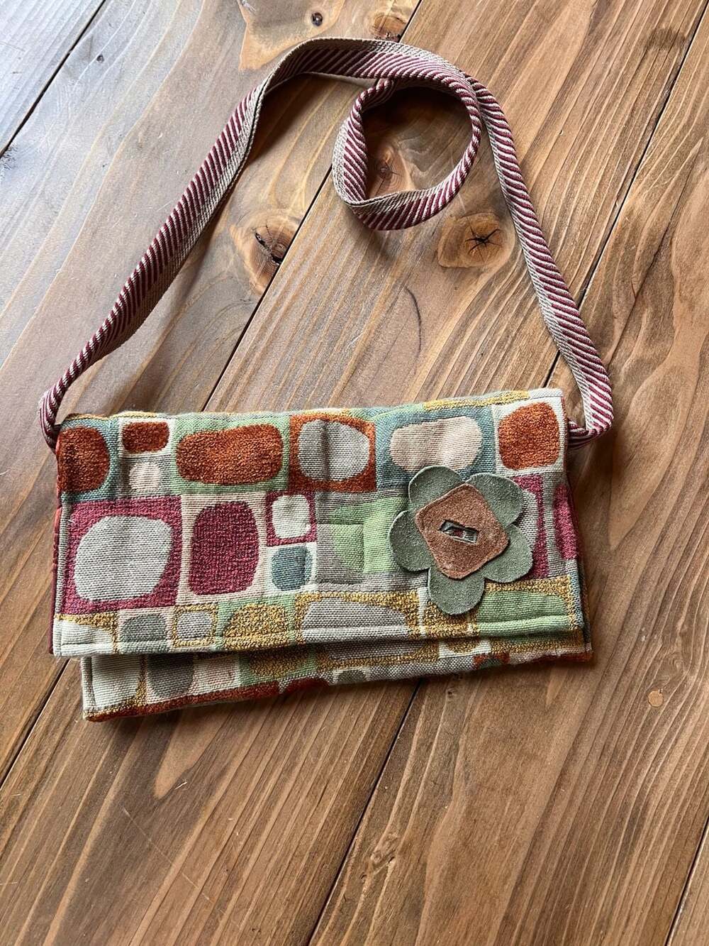 Artisan Geometric Tapestry Crossbody Bag with Leather Flower Accent